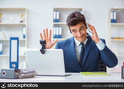 Young help desk operator working in office