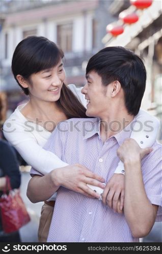Young Heterosexual Couple Looking at Each Other Outdoors in Beijing