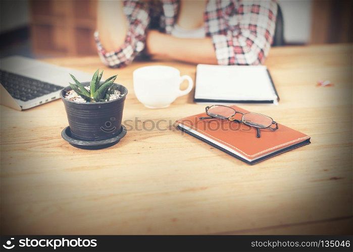 Young hipster woman sitting work in workplace.