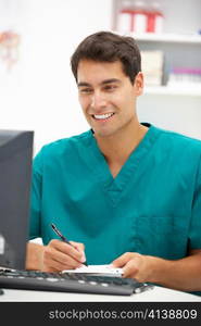 Young hospital doctor at desk