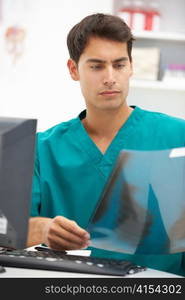 Young hospital doctor at desk