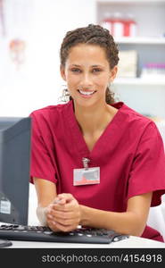 Young hospital doctor at desk