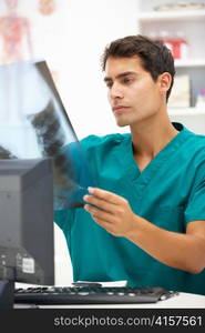 Young hospital doctor at desk