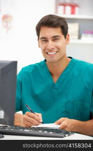 Young hospital doctor at desk