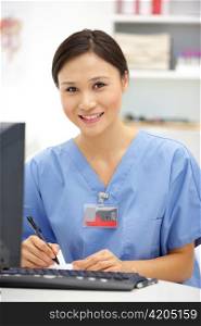 Young hospital doctor at desk