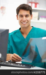 Young hospital doctor at desk