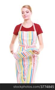 Young housewife wearing kitchen apron with oven cooking mitten, studio picture isolated on white