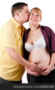 young husband is kissing his pregnant wife