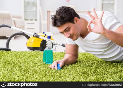 Young husband man cleaning floor at home