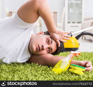 Young husband man cleaning floor at home. The young husband man cleaning floor at home