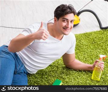 Young husband man cleaning floor at home. The young husband man cleaning floor at home