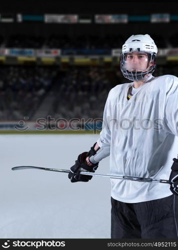 young ice hockey player portrait on training in black background