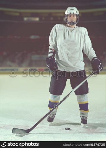 young ice hockey player portrait on training in black background. hockey player portrait