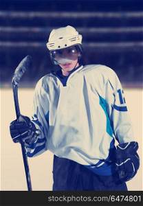 young ice hockey player portrait on training in black background. hockey player portrait