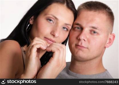 young in love Portrait of a beautiful young happy smiling couple young heart hand
