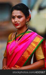 Young Indian girl in Nauwari sari , traditional Maharashtrian sari