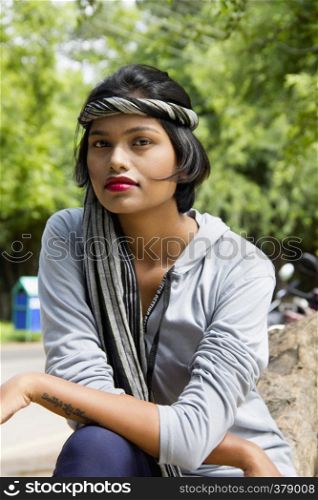 Young Indian girl with short hair wearing headgear and posing for camera, Pune. Young Indian girl with short hair wearing headgear and posing for camera, Pune.