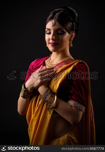 Young indian woman on black