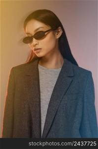 young japanese woman with jacket wearing sunglasses