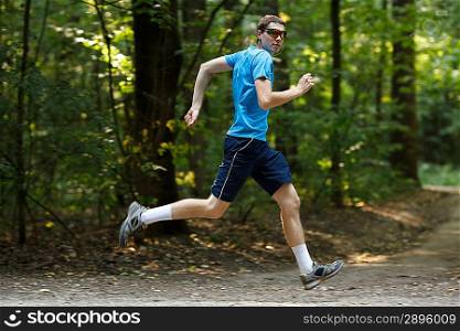 young jogger runnig at the park