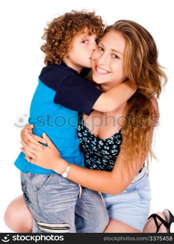 Young kid kissing his mom and looking at camera, isolated on white..