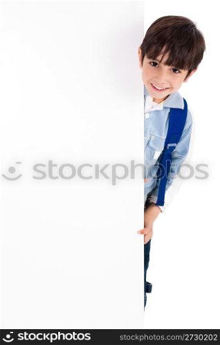 Young kid silently standing behind the board on white isolated background