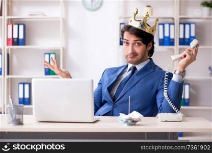 Young king businessman working in the office 