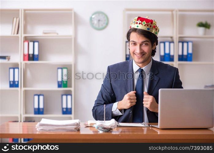 Young king businessman working in the office 