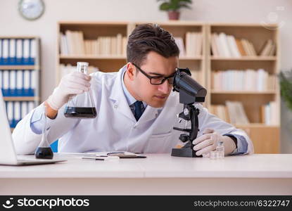 Young lab assistan working in the laboratory