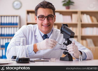 Young lab assistan working in the laboratory