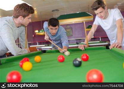 Young lads playing snooker