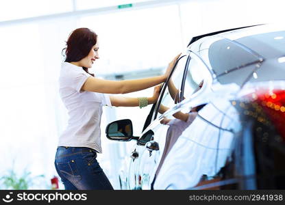 Young lady at car salon