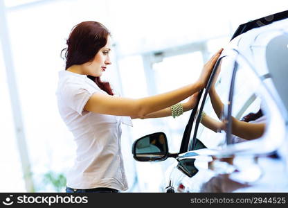 Young lady at car salon