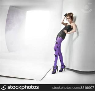 Young lady in an abstract studio interior