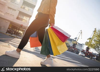 young lady with shopping bags street