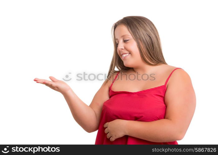 Young large beautiful woman presenting your product, isolated over white background