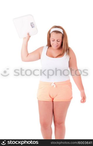 Young large woman with a scale - Diet Concept