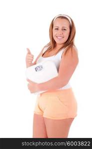 Young large woman with a scale - Diet Concept