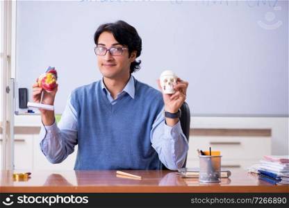 Young lecturer teacher teaching anatomy