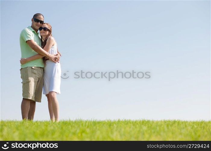 young love couple hug in the park