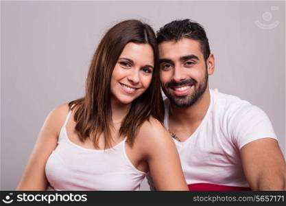 Young love couple relaxing together in bed