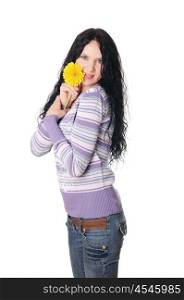 Young lovely brunette playing with a yellow flower isolated on white