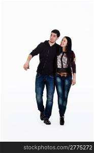 Young lovers walk their talk, they have fun. Shot in studio over white background.