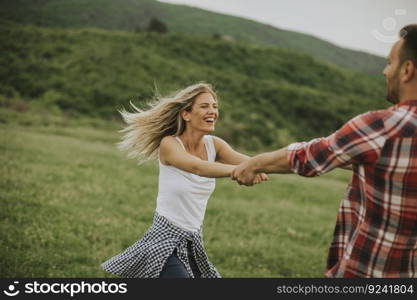 Young loving coulpe having fun in the spring nature