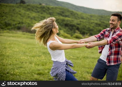 Young loving coulpe having fun in the spring nature