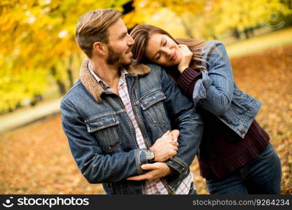 Young loving couple having a walk in the autumn park