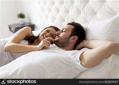 Young loving couple in the bed