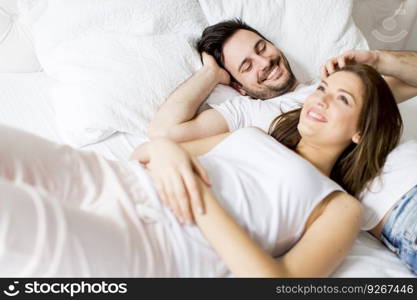 Young loving couple in the bed