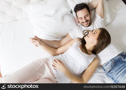 Young loving couple in the bed