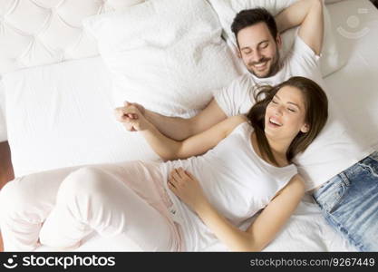 Young loving couple in the bed